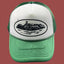 Corteiz Vintage Green and White Trucker Hat with Oval Cruise Ship Graphic